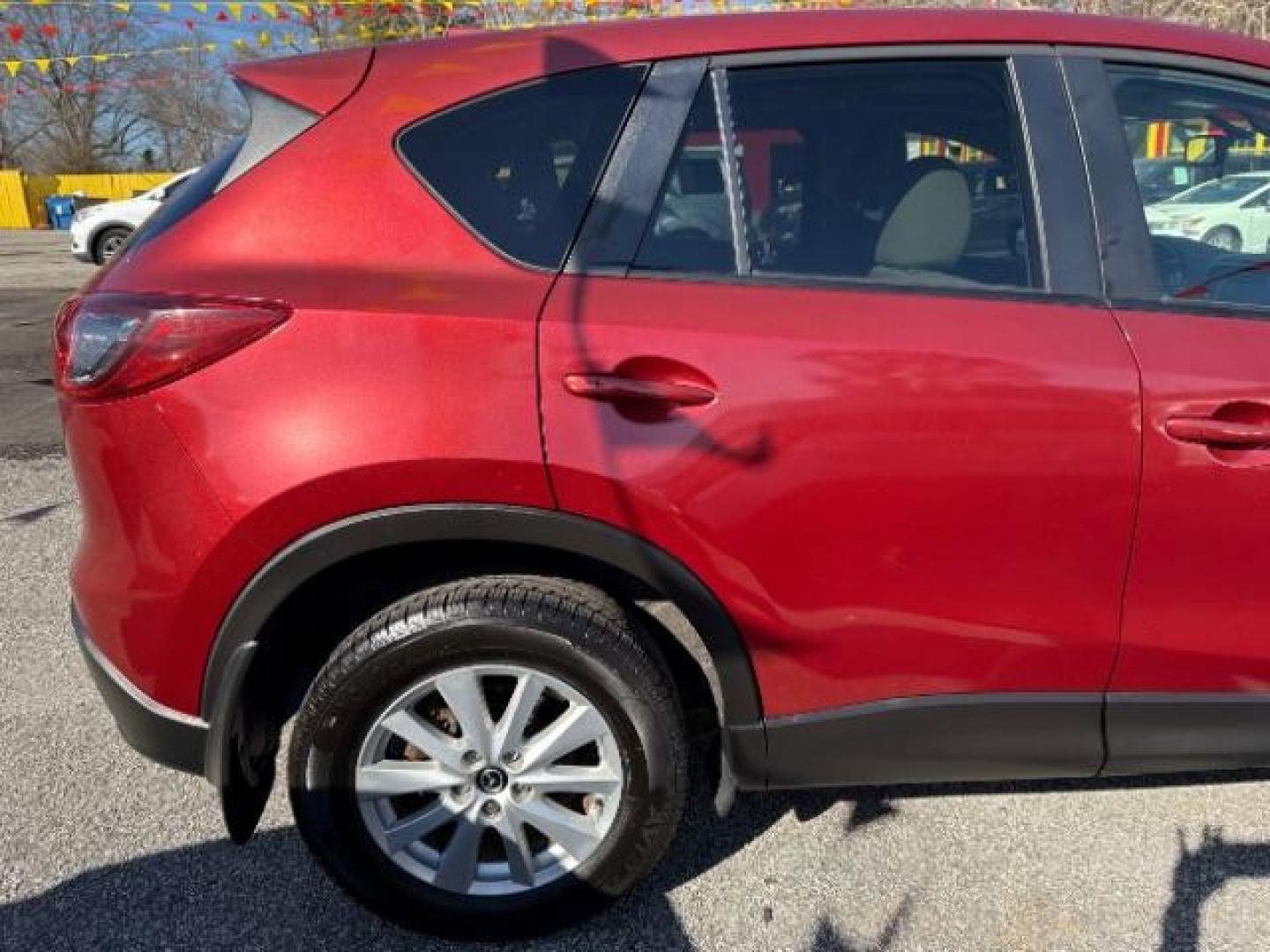 2013 Red Mazda CX-5 Touring (JM3KE2CE5D0) with an SKYACTIV-G 2L I-4 gasoline direct injection engine, located at 1806 Veterans Memorial Hwy SW, Austell, GA, 30168, (770) 944-9558, 33.817959, -84.606987 - Photo#8