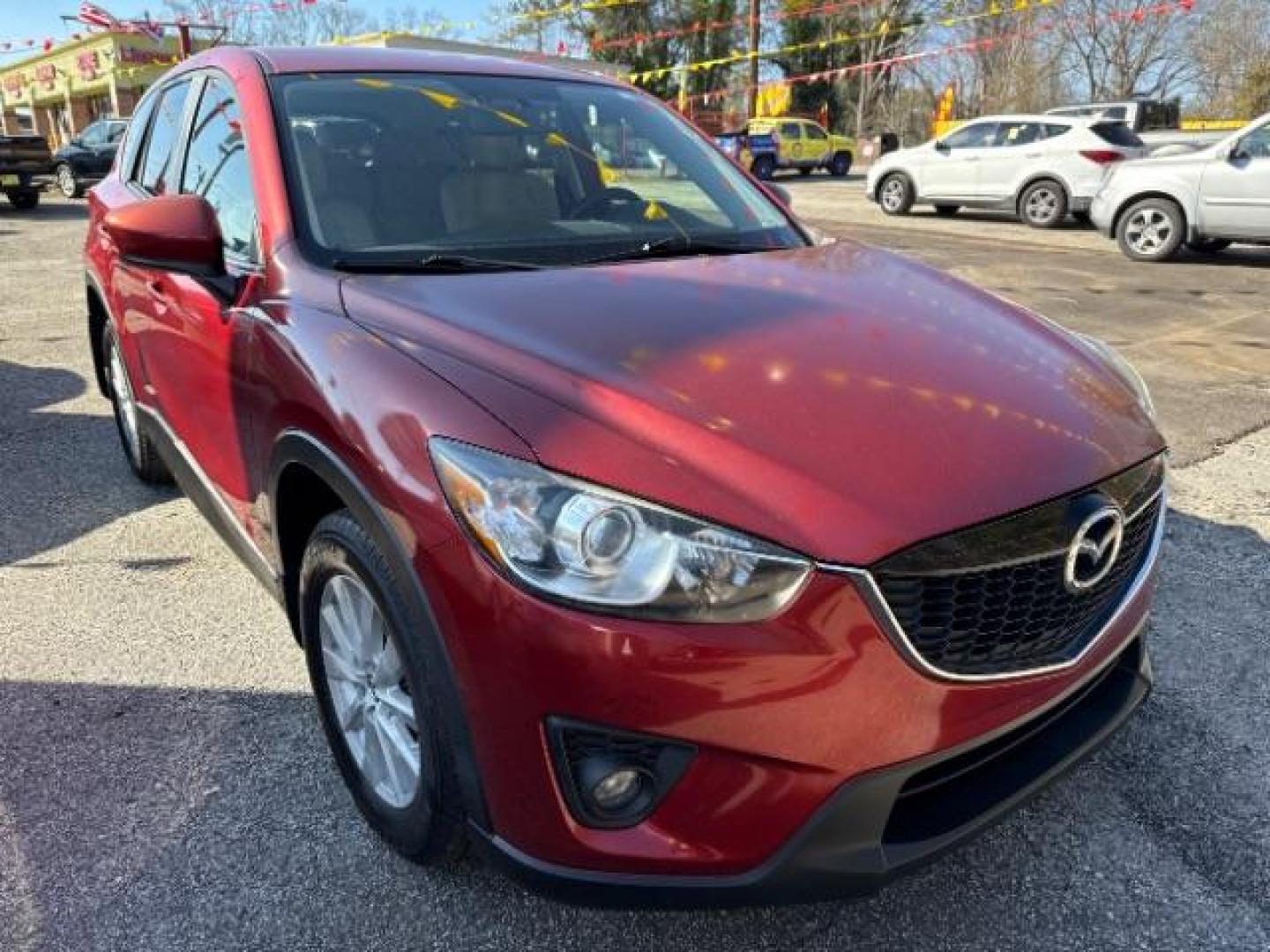 2013 Red Mazda CX-5 Touring (JM3KE2CE5D0) with an SKYACTIV-G 2L I-4 gasoline direct injection engine, located at 1806 Veterans Memorial Hwy SW, Austell, GA, 30168, (770) 944-9558, 33.817959, -84.606987 - Photo#10