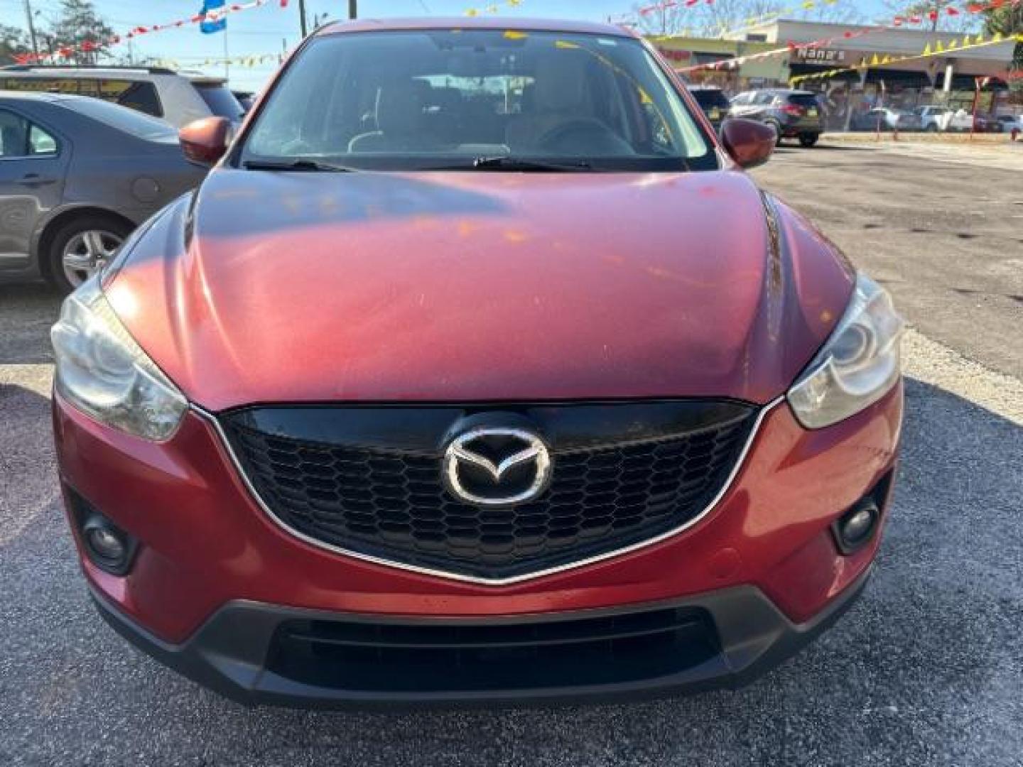 2013 Red Mazda CX-5 Touring (JM3KE2CE5D0) with an SKYACTIV-G 2L I-4 gasoline direct injection engine, located at 1806 Veterans Memorial Hwy SW, Austell, GA, 30168, (770) 944-9558, 33.817959, -84.606987 - Photo#11