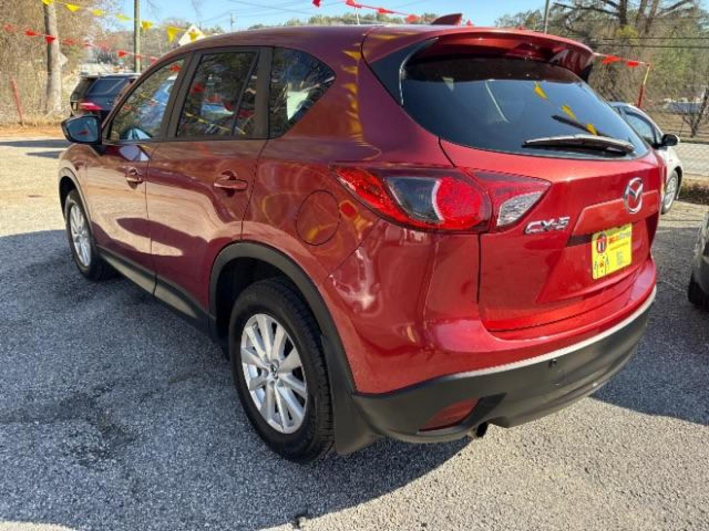 2013 Red Mazda CX-5 Touring (JM3KE2CE5D0) with an SKYACTIV-G 2L I-4 gasoline direct injection engine, located at 1806 Veterans Memorial Hwy SW, Austell, GA, 30168, (770) 944-9558, 33.817959, -84.606987 - Photo#3