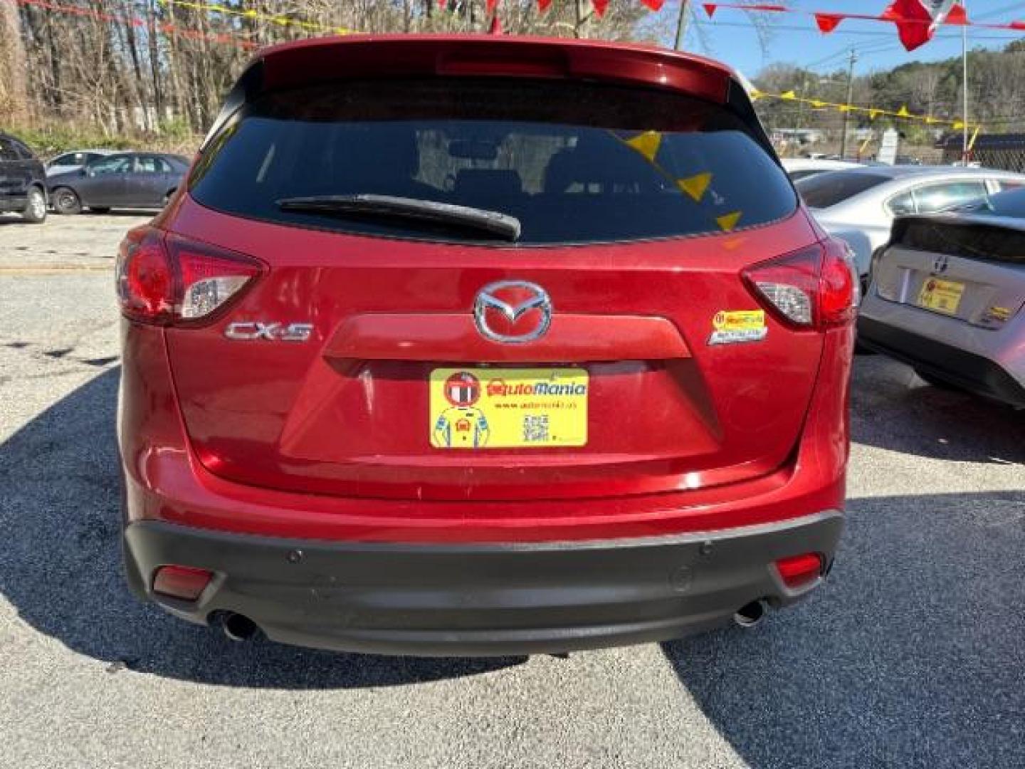 2013 Red Mazda CX-5 Touring (JM3KE2CE5D0) with an SKYACTIV-G 2L I-4 gasoline direct injection engine, located at 1806 Veterans Memorial Hwy SW, Austell, GA, 30168, (770) 944-9558, 33.817959, -84.606987 - Photo#4