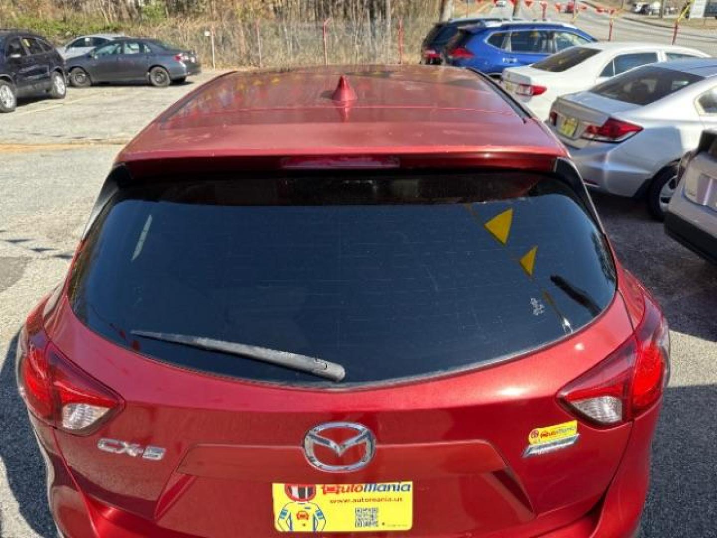 2013 Red Mazda CX-5 Touring (JM3KE2CE5D0) with an SKYACTIV-G 2L I-4 gasoline direct injection engine, located at 1806 Veterans Memorial Hwy SW, Austell, GA, 30168, (770) 944-9558, 33.817959, -84.606987 - Photo#5