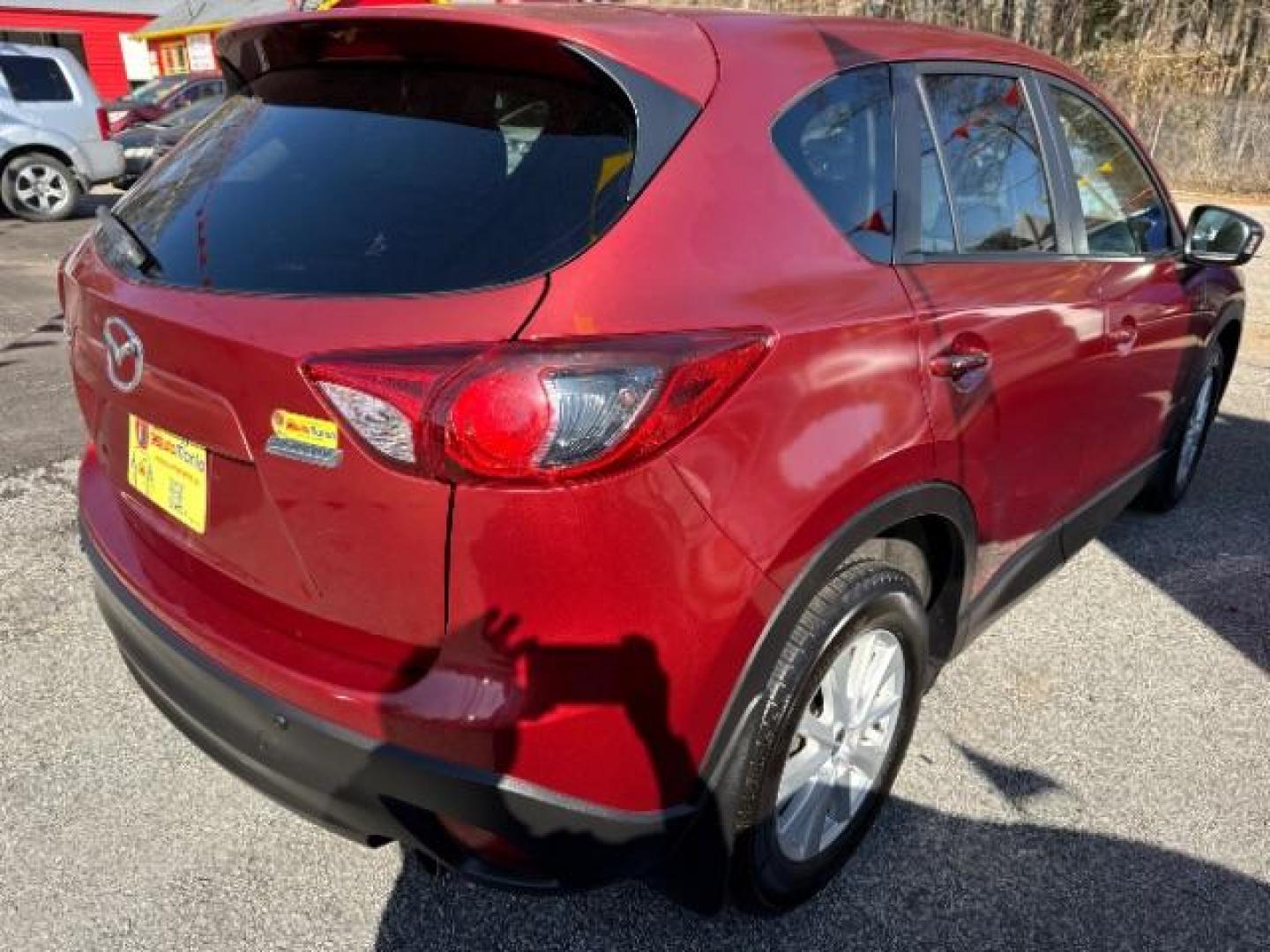 2013 Red Mazda CX-5 Touring (JM3KE2CE5D0) with an SKYACTIV-G 2L I-4 gasoline direct injection engine, located at 1806 Veterans Memorial Hwy SW, Austell, GA, 30168, (770) 944-9558, 33.817959, -84.606987 - Photo#7