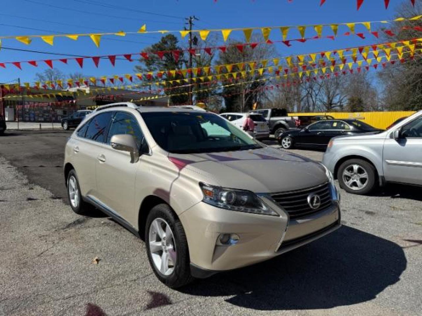 2013 Gold Lexus RX 350 BASE (2T2ZK1BAXDC) with an 3.5L V6 SFI DOHC engine, located at 1806 Veterans Memorial Hwy SW, Austell, GA, 30168, (770) 944-9558, 33.817959, -84.606987 - Photo#2